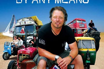 Filmplakat für 'By any means' mit Charley Boorman im Vordergrund und diverse Fahrzeuge, Tuktuks, Busse und einem Elefant im Hintergrund